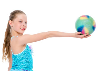 Girl gymnast performs exercises with the ball.