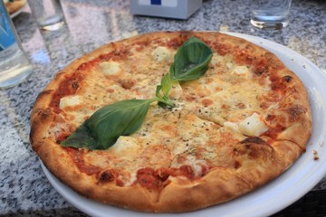 Cheese pizza with basil