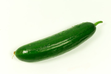 Big green cucumber on a white background