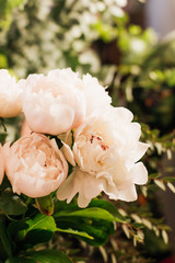 Beautiful spring bouquet with tender pink peony flowers, elegant floral decoration