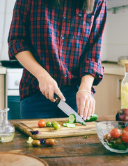 Young woman cooking healthy vegetarian simple food home kitchen sunny evening Healthy food concept