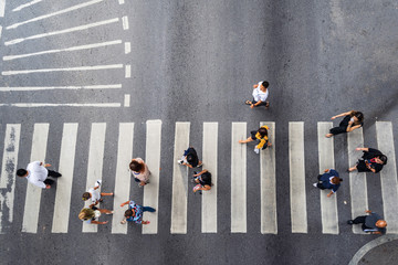 Aerial photo top view of people walk on street in the city over pedestrian crossing traffic road