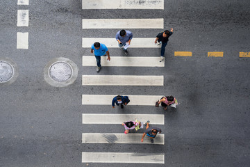 Aerial photo top view of people walk on street in the city over pedestrian crossing traffic road