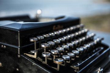 typewriter on the background of the sea at dawn. summer beach