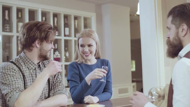Beautiful couple in a restaurant. Cheerful couple in restaurant making an order. Romantic couple dating in pub