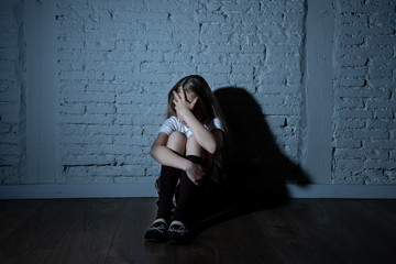 Depressed child victim of bullying feeling sad, unhappy, lonely, scared, abused and isolated.
