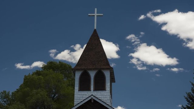 Time lapse of clouds and a church steeple