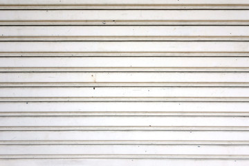 white metal roller shutter door, corrugated steel sheet texture background