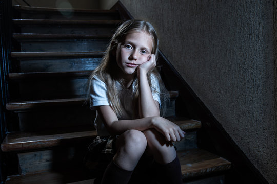 Beautiful lonely young girl depressed and worried suffering from bullying and harassment at school