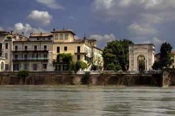 Verona cityscape view on the riverside with historical buildings