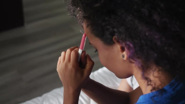Woman Holding Negative Pregnancy Test Kit