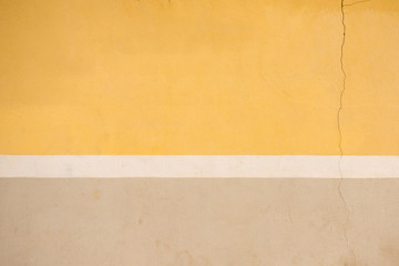 Painted yellow, white and beige wall background
