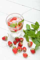Strawberry detox water with mint, antioxidant gourmet in glass.