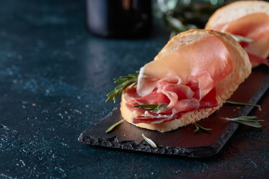 Sandwich with prosciutto and rosemary.