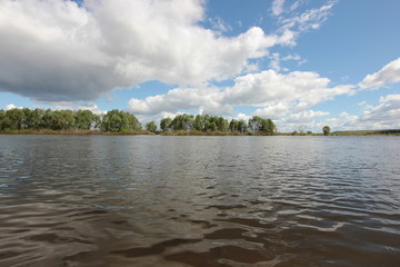 the beautiful landscape with low clouds over the river