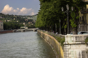 Fototapeta na wymiar Verona cityscape view on the riverside with historical buildings
