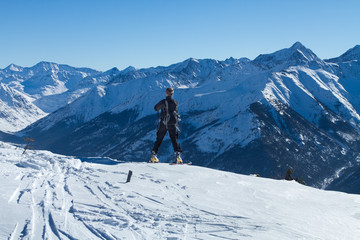 A man stands on top of a mountain
