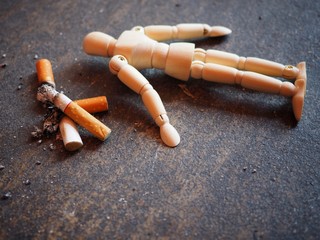 The cigarette burns out and the dummy is dumped like a dead smoker. In the concept of stop smoking 31 May World No Tobacco Day