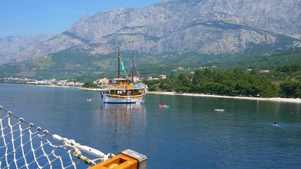 A man jumps off a boat into the waters of the Adriatic Sea in Croatia on June 14, 2014