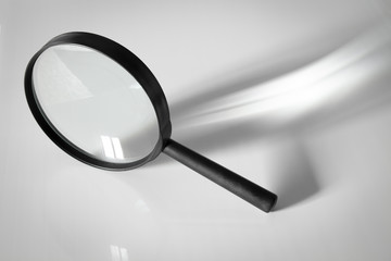 Magnifier with handle close-up on a white background.