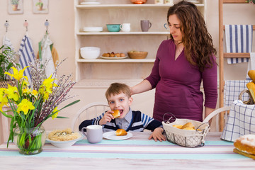 Happy mother and son in the kitchen.