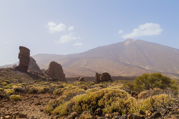 Fototapeta na wymiar Teide National Park. Volcanic mountain scenery. Pico del Teide. View of Teide volcano peak and Teleferico Del Teide cable road. Tenerife, Canary Islands, Spain 