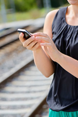 Closeup of woman hands using phone