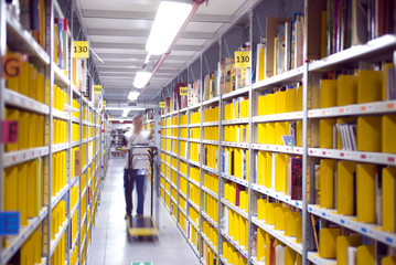 logistic warehouse, interior with a picker working
