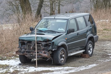 SUV car after crash, crashed blue car. Front accident damage