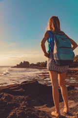 Girl enjoying sea / ocean scenery in Bali, Indonesia.