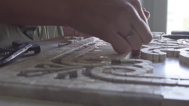 Master collects panels from the details made of marble video