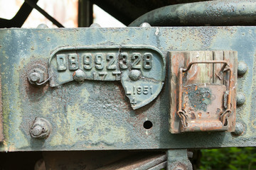 Broken number plate on railway wagon.