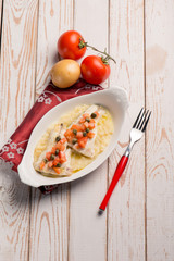 sea bass with fresh tomatoes over mashed potatoes