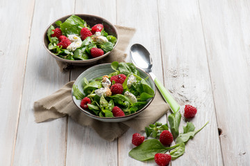 mixed salad with valerian raspberries and cheese