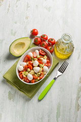 salad with mozzarella tomatoes and avocado