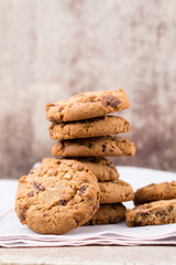 Chocolate oatmeal cookies on the wooden background.