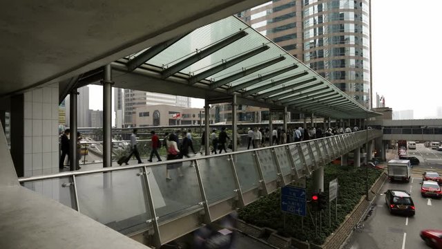People walking across an elevated walkway in Central, Hong Kong Island, Hong Kong, China, T/lapse