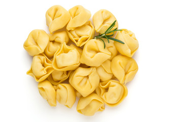 Raw homemade pasta,tortellini with herbs.