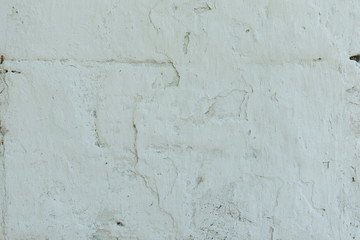 Wall fragment with scratches and cracks