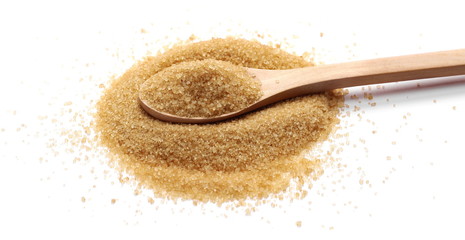 Brown cane sugar pile in wooden spoon isolated on white background, sugarcane texture