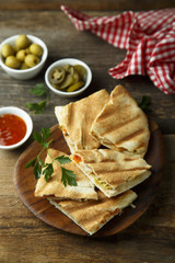 Homemade quesadilla with hot tomato sauce and cheese