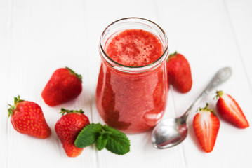Jar with strawberry smoothie