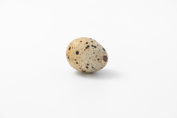 eggs quail spotted small on white background.