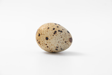 eggs quail spotted small on white background.