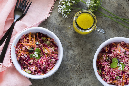 Pink and red Millet Salad in bowls with a pink napkin