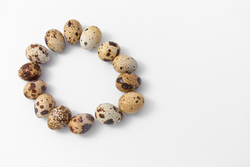 eggs quail spotted small on white background.