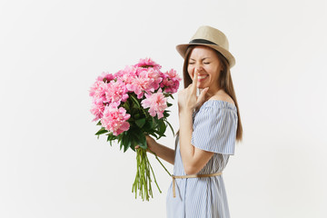 Young fun woman in blue dress, hat holding bouquet of beautiful pink peonies flowers isolated on white background. St. Valentine's Day, International Women's Day holiday concept. Advertising area.