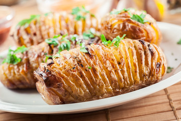 Baked potatoes with cheese and herbs