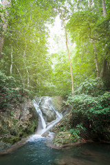 Natural waterfall in the deep forest in Thailand.