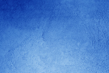 Fototapeta na wymiar Plaster wall texture in navy blue color.